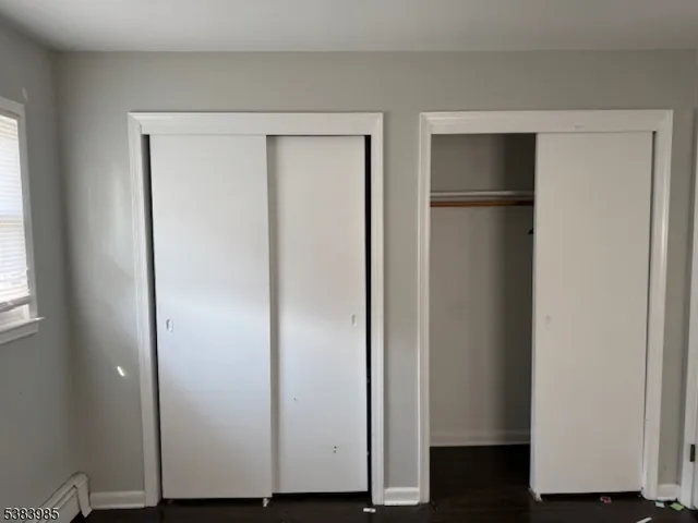 a view of hallway with wooden floor