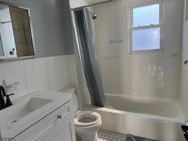 a bathroom with a sink a toilet and a bathtub