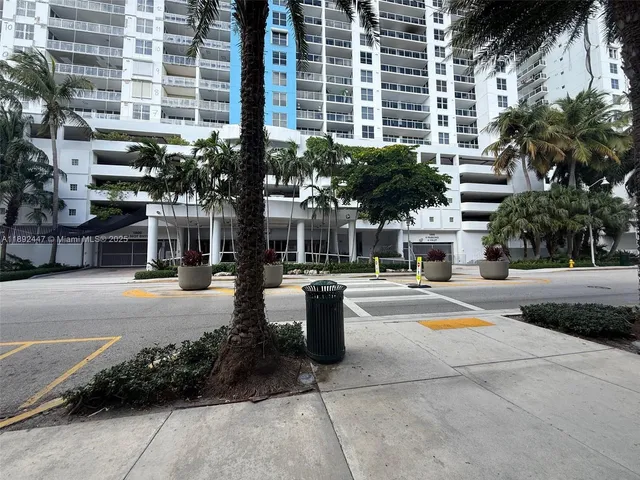 a front view of a building with street view