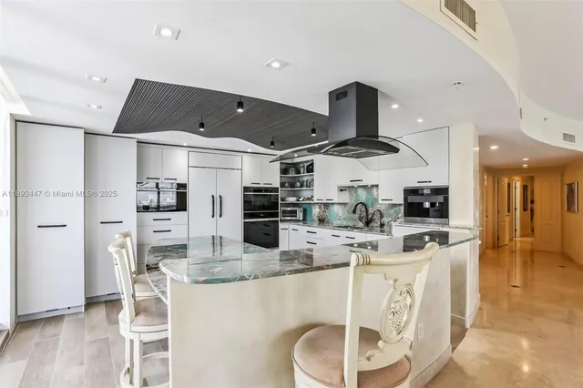 a kitchen with sink cabinets and window