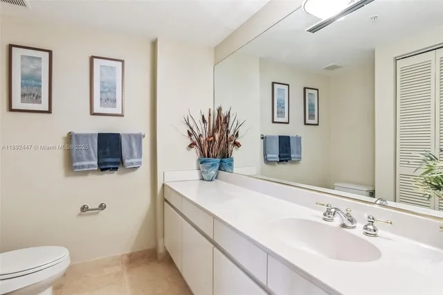 a bedroom with a bed and a large window with outer view