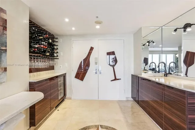 a living room with furniture a flat screen tv and a potted plant