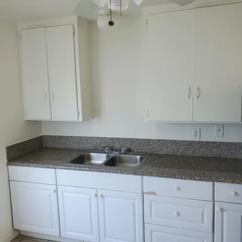 a bathroom with a toilet a sink and bathtub
