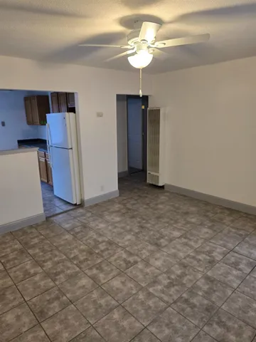 a kitchen with a stove cabinets and a refrigerator