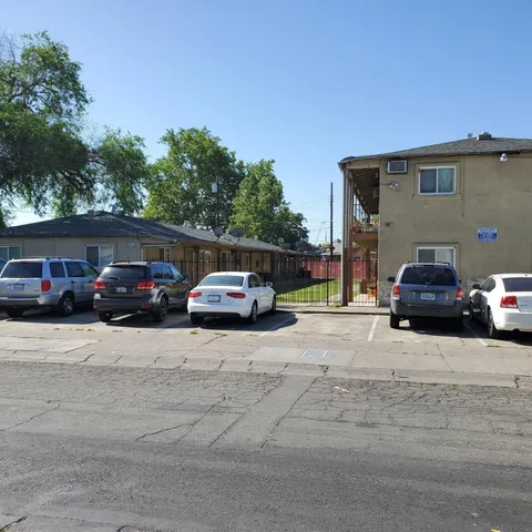 a view of a car parked in front of a house