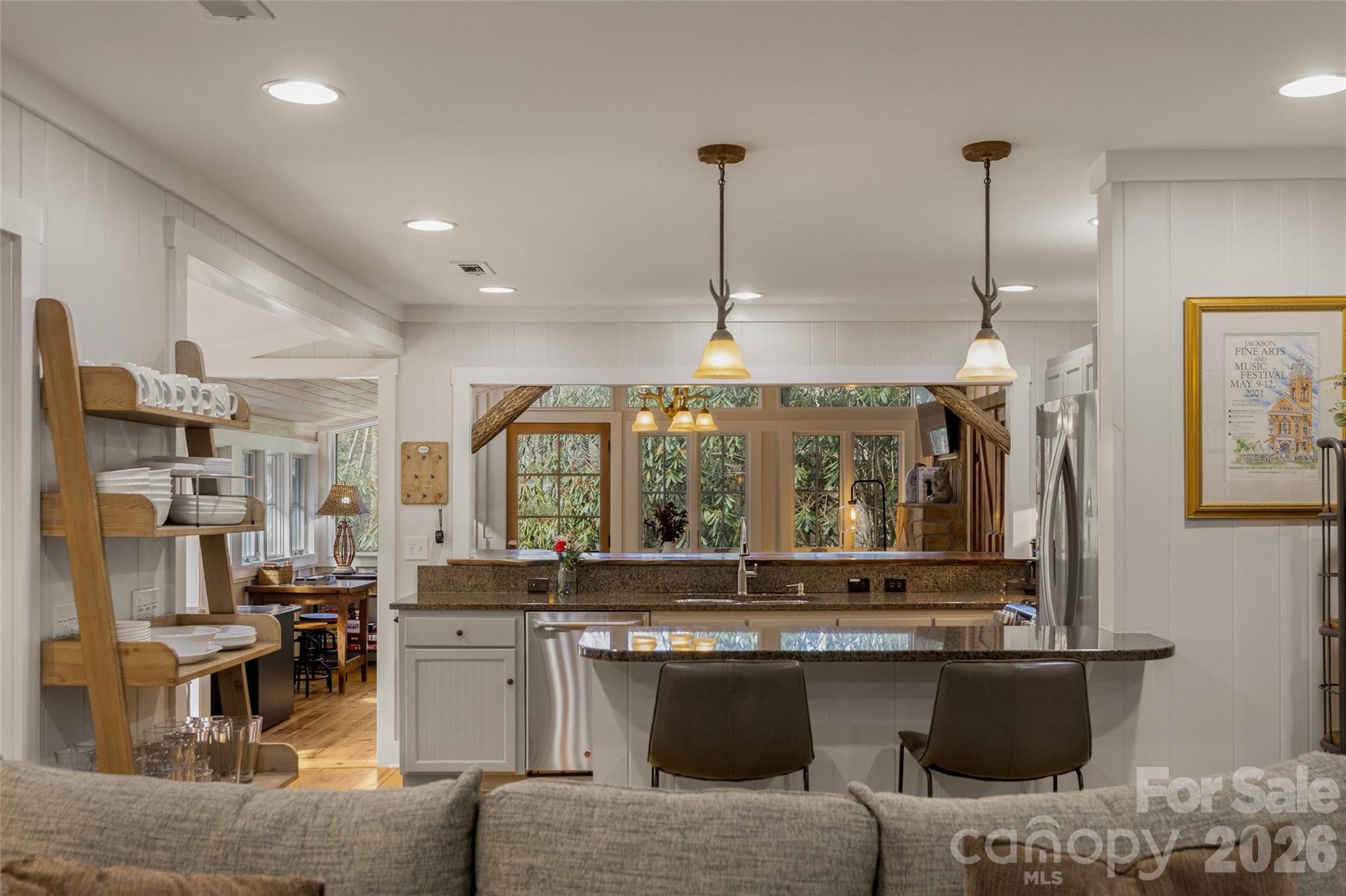 464 Franklin Road Highlands, NC 28741 - Photo 13 of 44 a open kitchen with stainless steel appliances granite countertop a stove and a sink