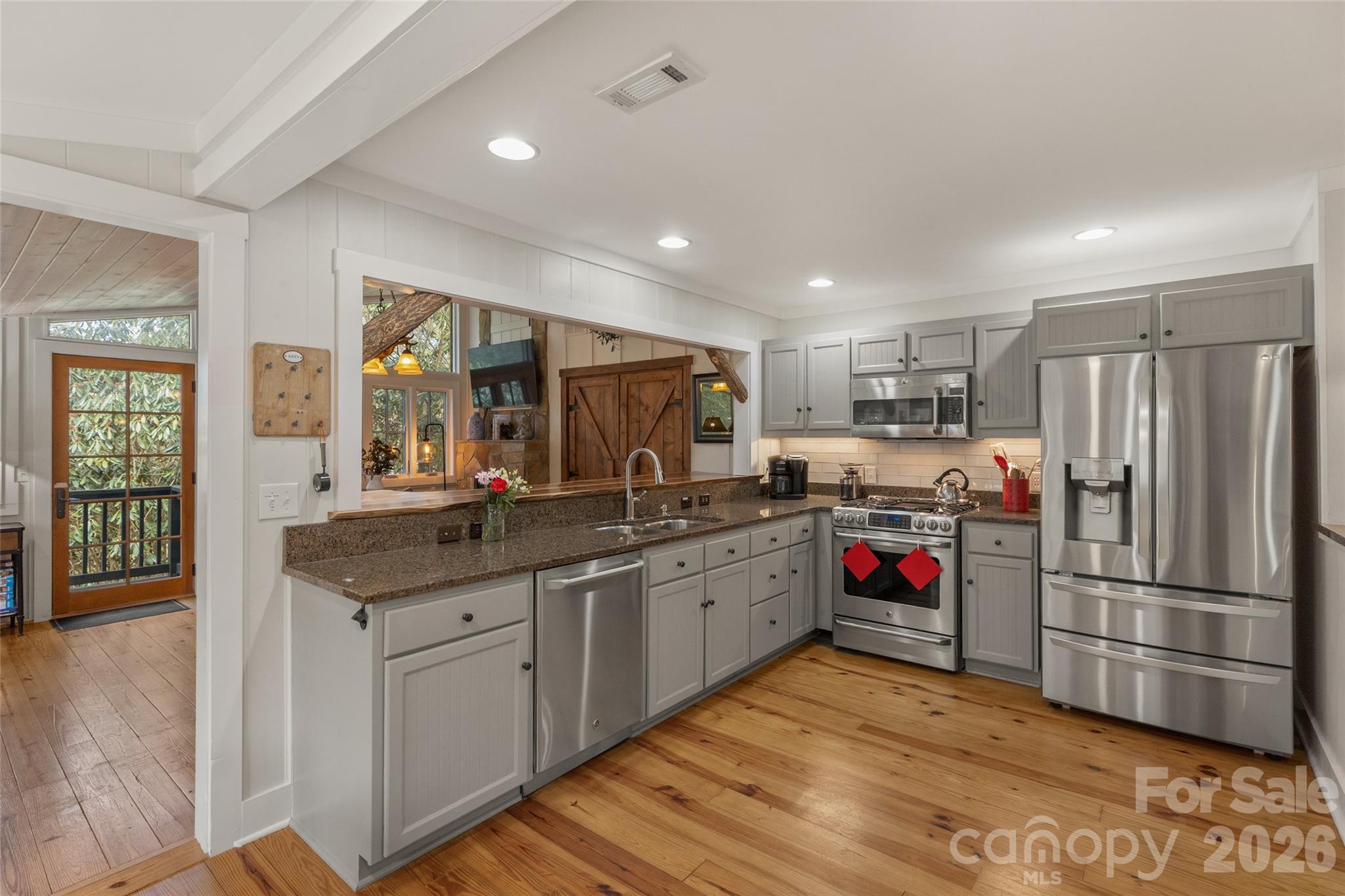 464 Franklin Road Highlands, NC 28741 - Photo 18 of 44 a kitchen with stainless steel appliances granite countertop a refrigerator and a sink