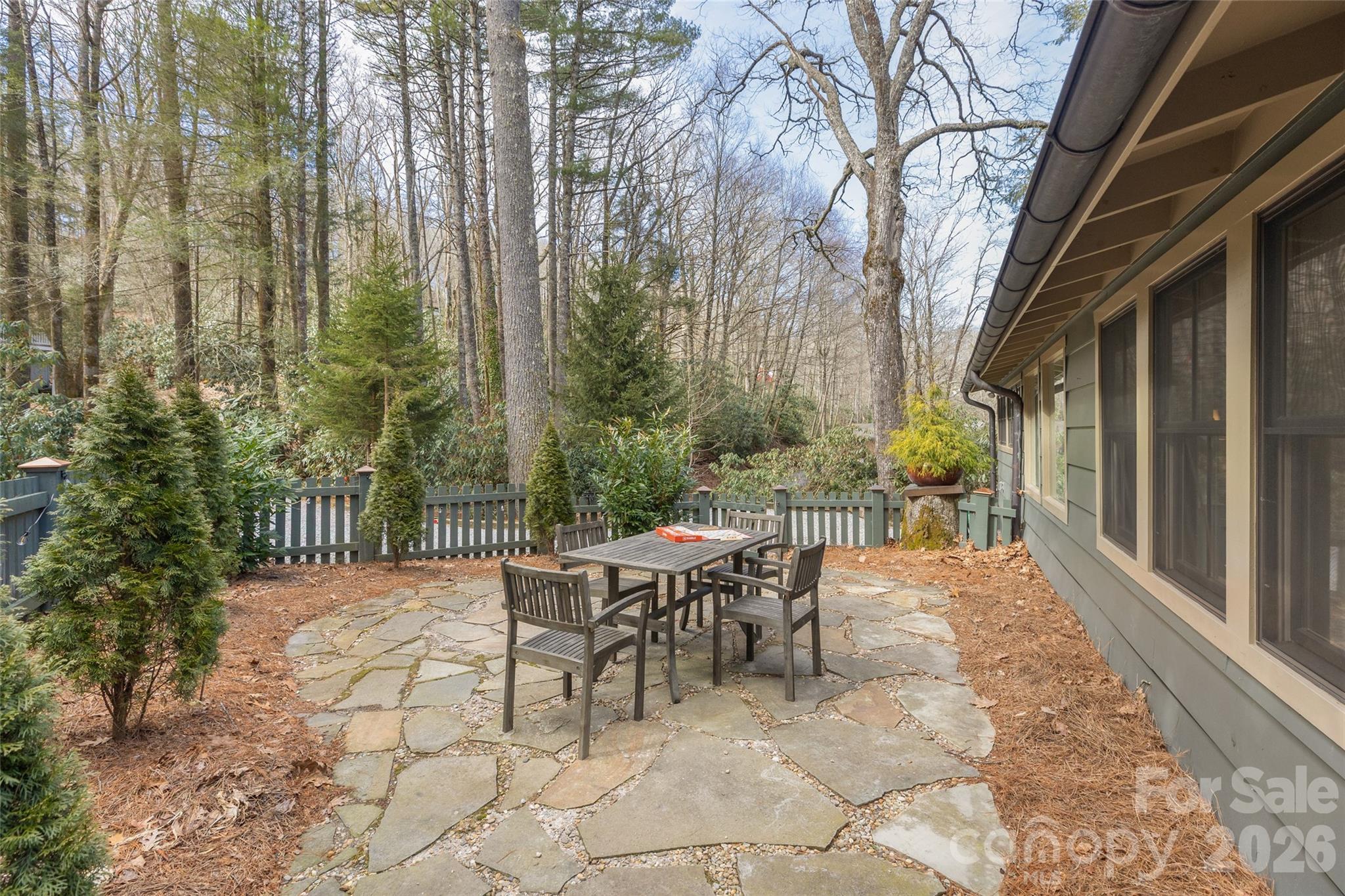 464 Franklin Road Highlands, NC 28741 - Photo 21 of 44 a view of a patio with a table and chairs