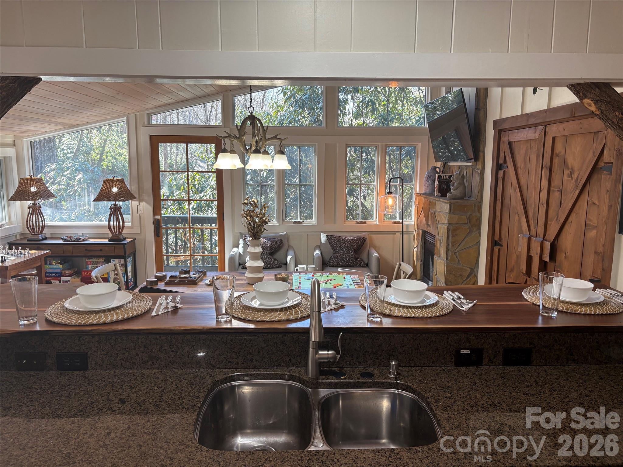 464 Franklin Road Highlands, NC 28741 - Photo 23 of 44 a kitchen with a sink and a stove next to a large window