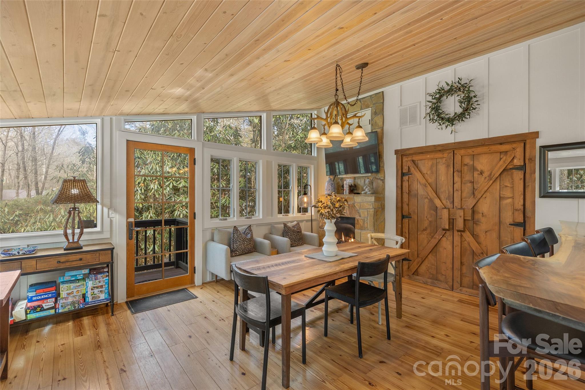 464 Franklin Road Highlands, NC 28741 - Photo 25 of 44 a living room with furniture and a floor to ceiling window