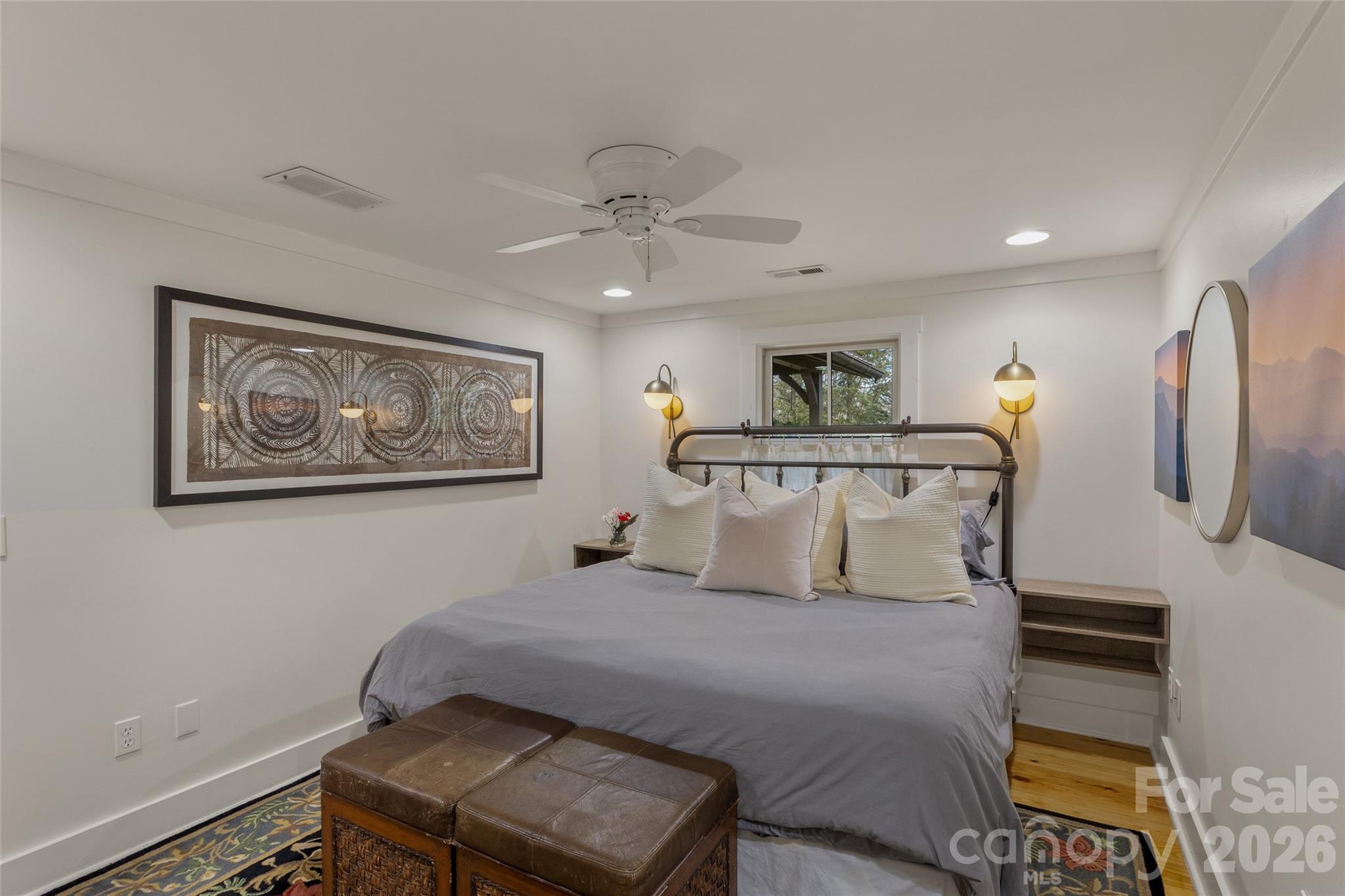 464 Franklin Road Highlands, NC 28741 - Photo 31 of 44 a bedroom with a large bed and a chandelier