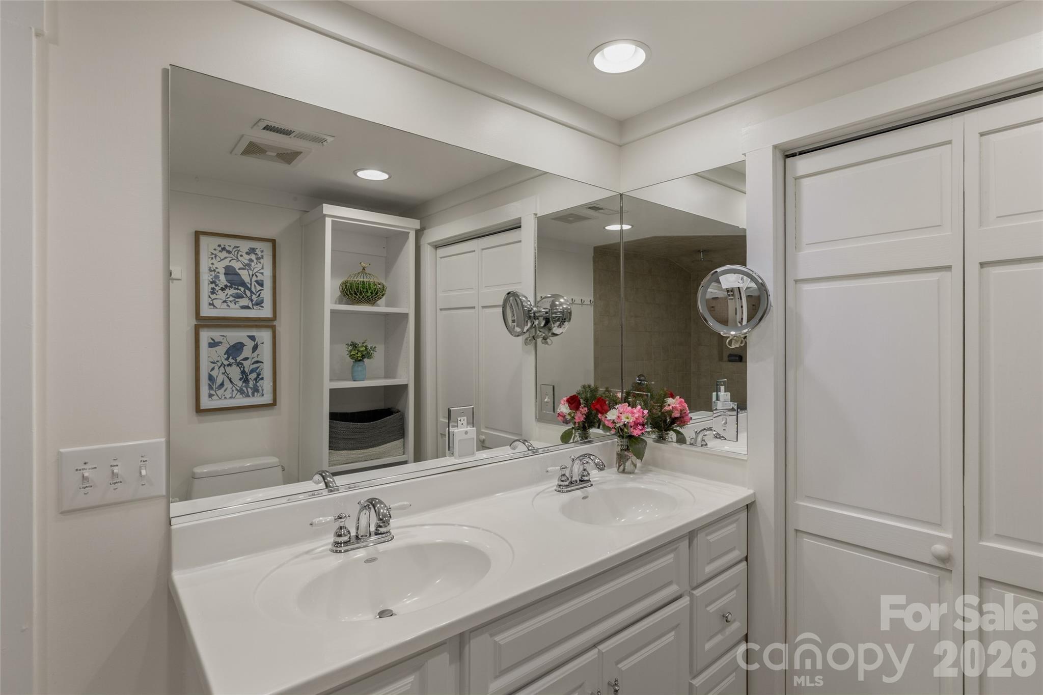 464 Franklin Road Highlands, NC 28741 - Photo 33 of 44 a bathroom with a sink vanity and a mirror