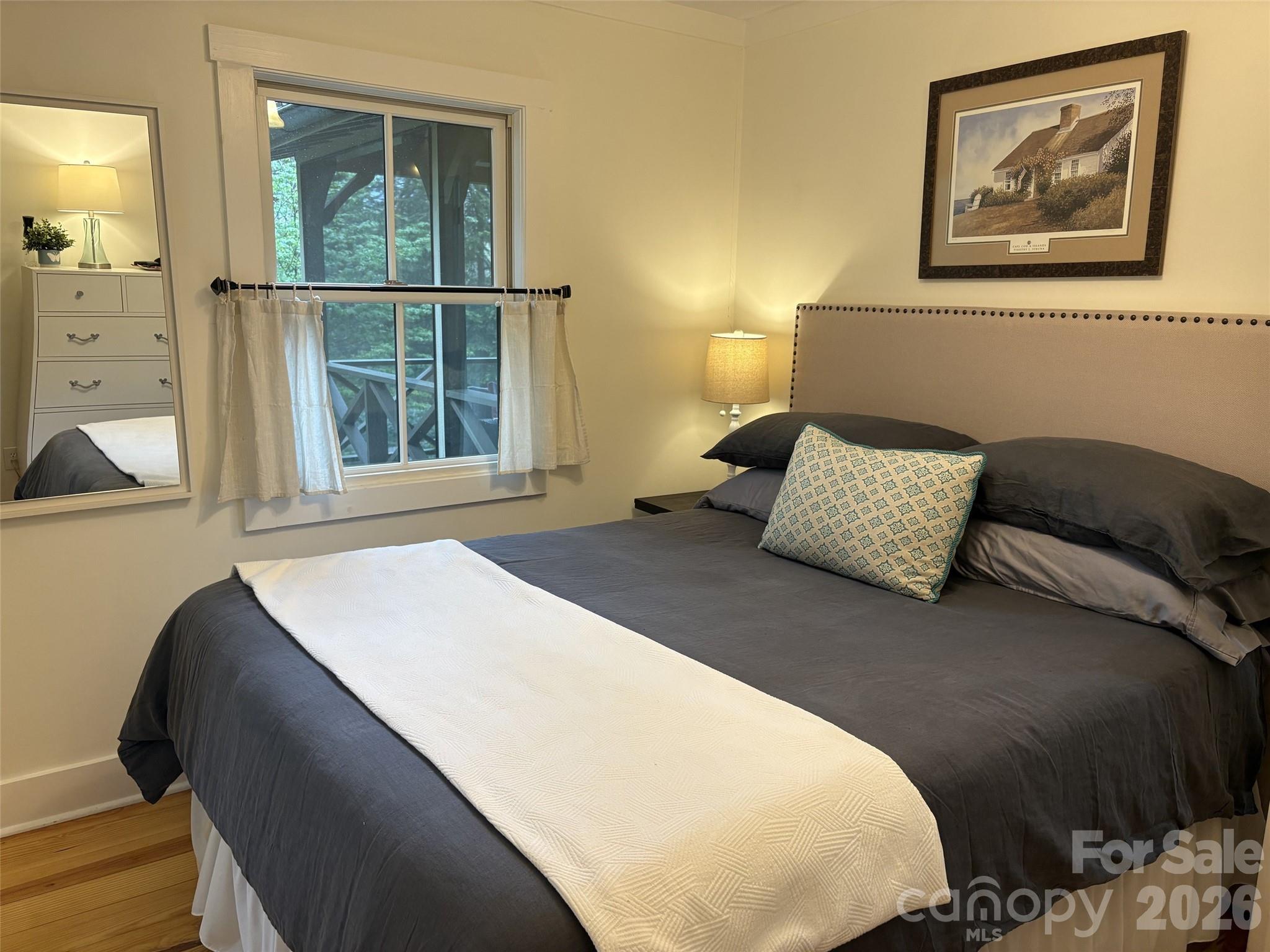 464 Franklin Road Highlands, NC 28741 - Photo 38 of 44 a bedroom with a bed and a window