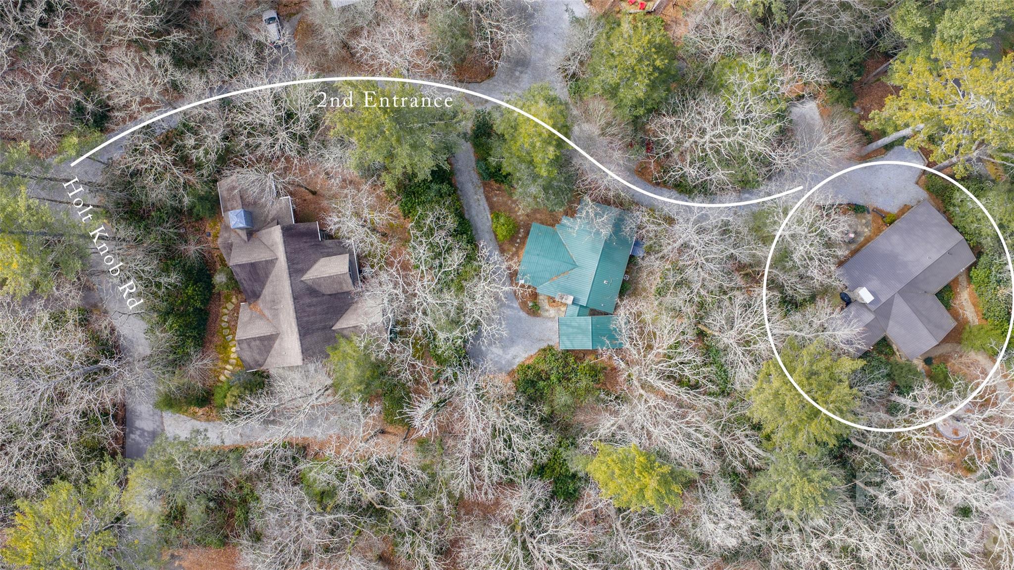 464 Franklin Road Highlands, NC 28741 - Photo 42 of 44 an aerial view of a house with a yard and large trees