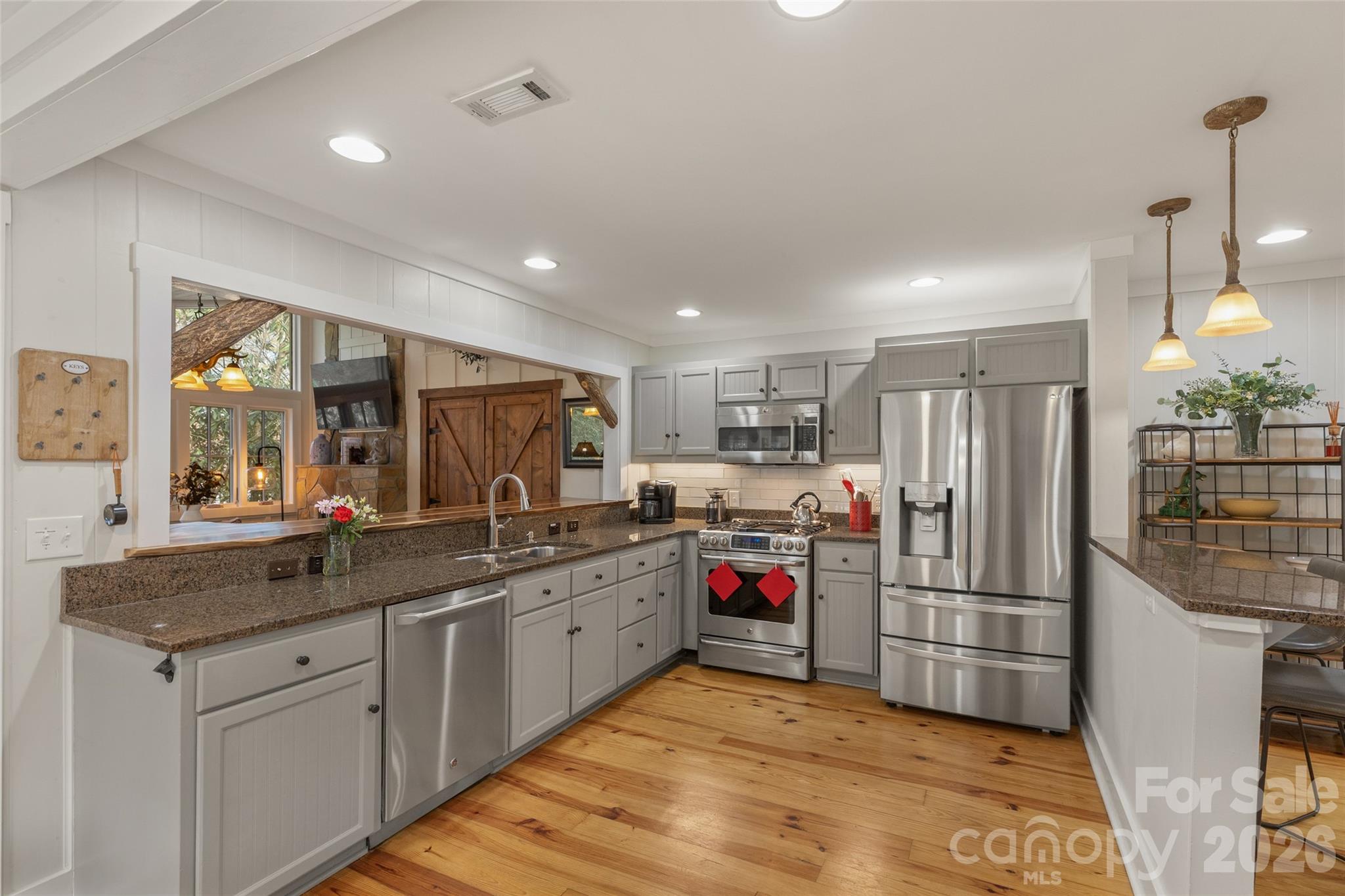 464 Franklin Road Highlands, NC 28741 - Photo 7 of 44 a kitchen with refrigerator and sink