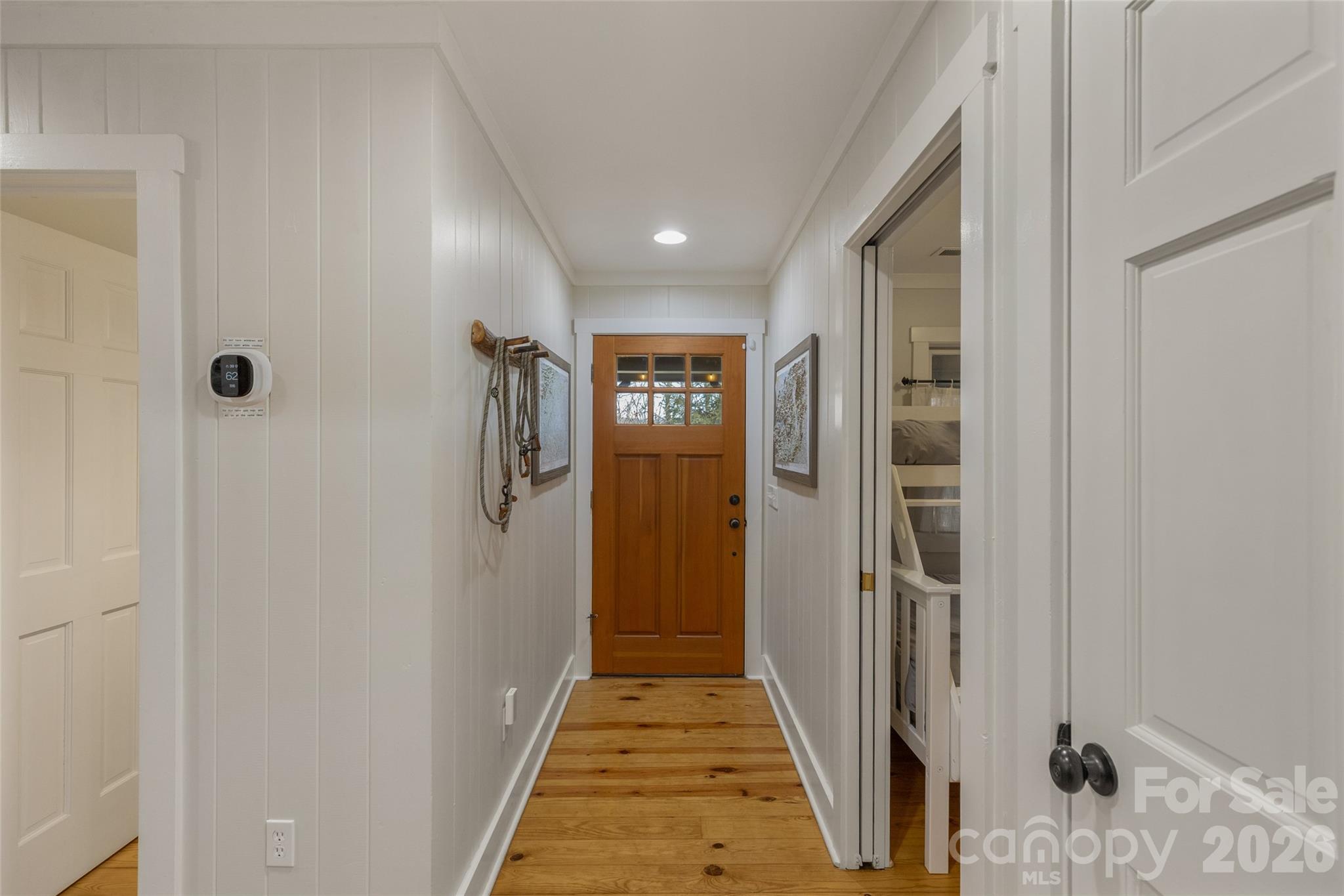 464 Franklin Road Highlands, NC 28741 - Photo 9 of 44 a view of a hallway with wooden floor and staircase