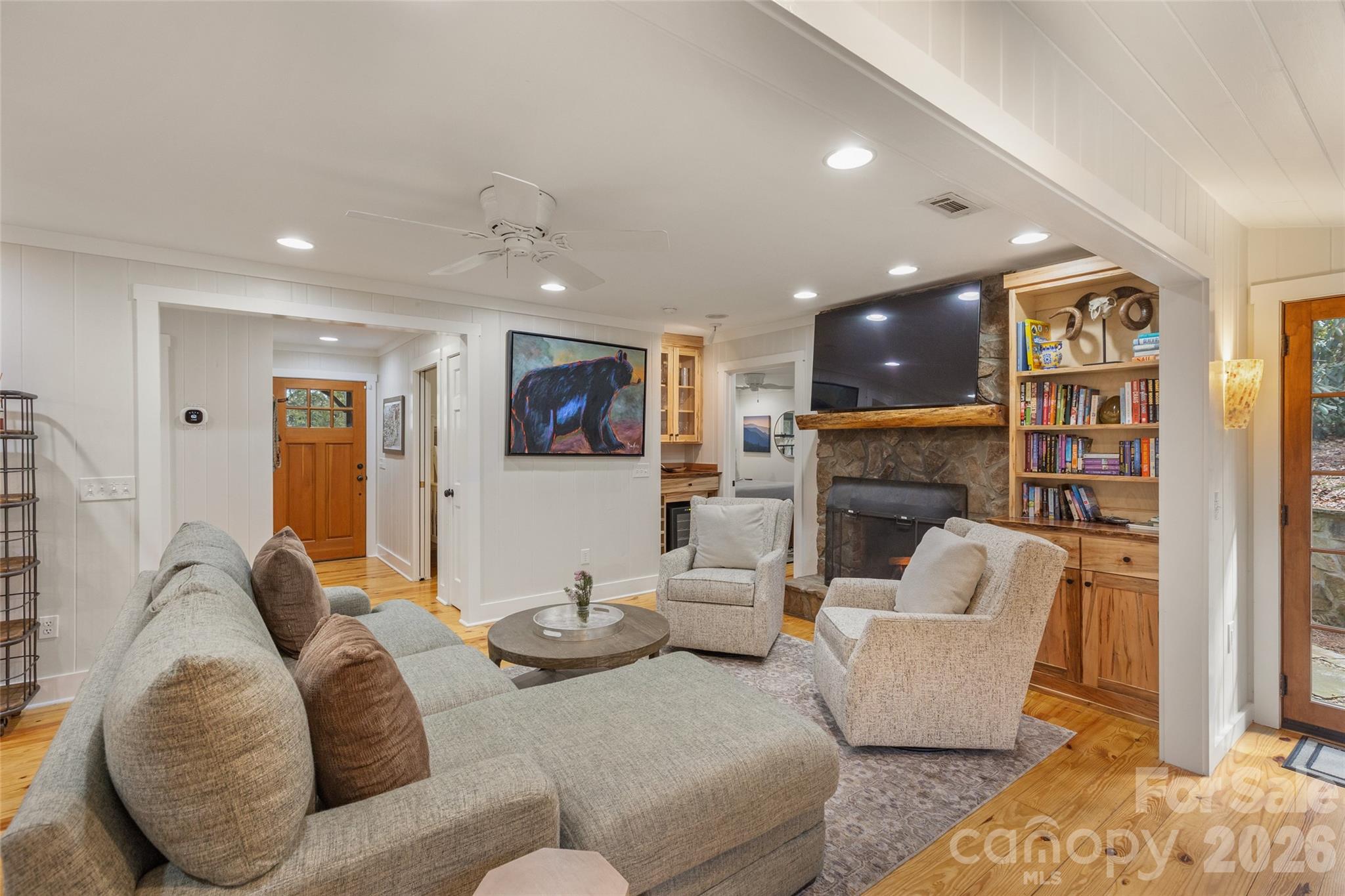 464 Franklin Road Highlands, NC 28741 - Photo 10 of 44 a living room with furniture and a fireplace