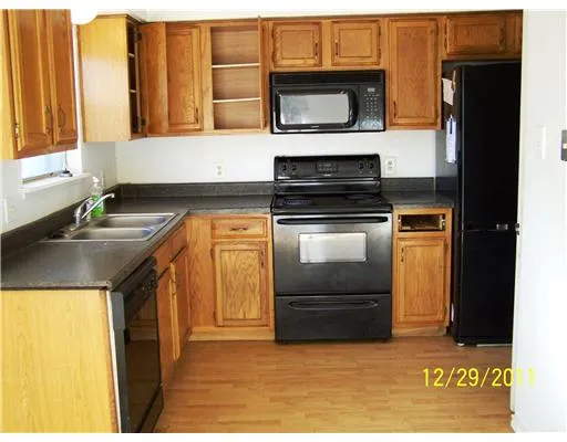 a kitchen with a stove and a microwave