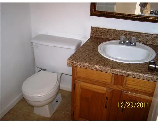 a bathroom with a toilet and a sink