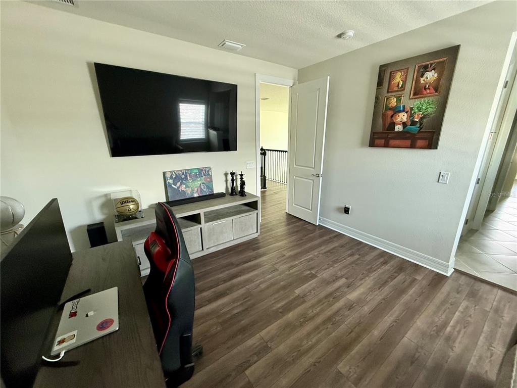 8441 Pk Clf Way Orlando, FL 32836 - Photo 27 of 59 a living room with furniture and a flat screen tv