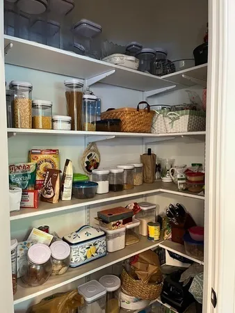 a kitchen with lots of bottles of alcohol