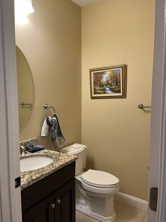 88 Indian Ridge Terrace, Unit 88 Westford, MA 01886 - Photo 15 of 39 a bathroom with a granite countertop sink and a toilet