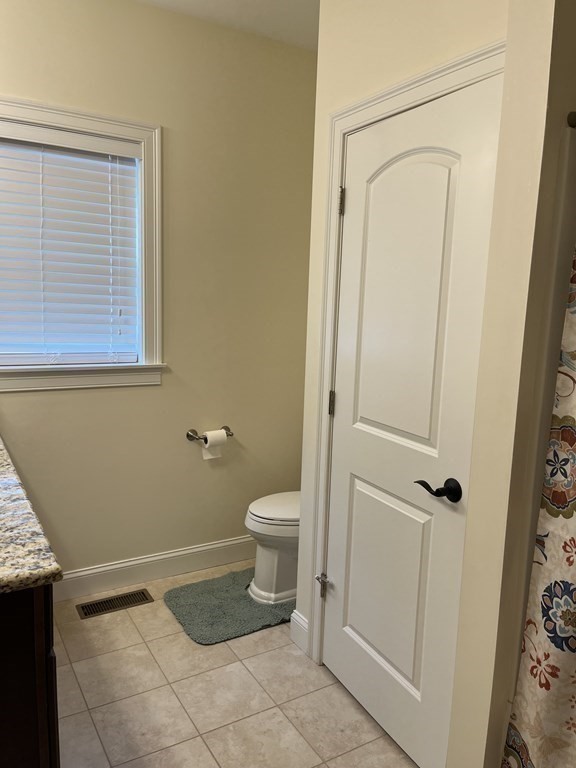 88 Indian Ridge Terrace, Unit 88 Westford, MA 01886 - Photo 19 of 39 a bathroom with a toilet and a shower