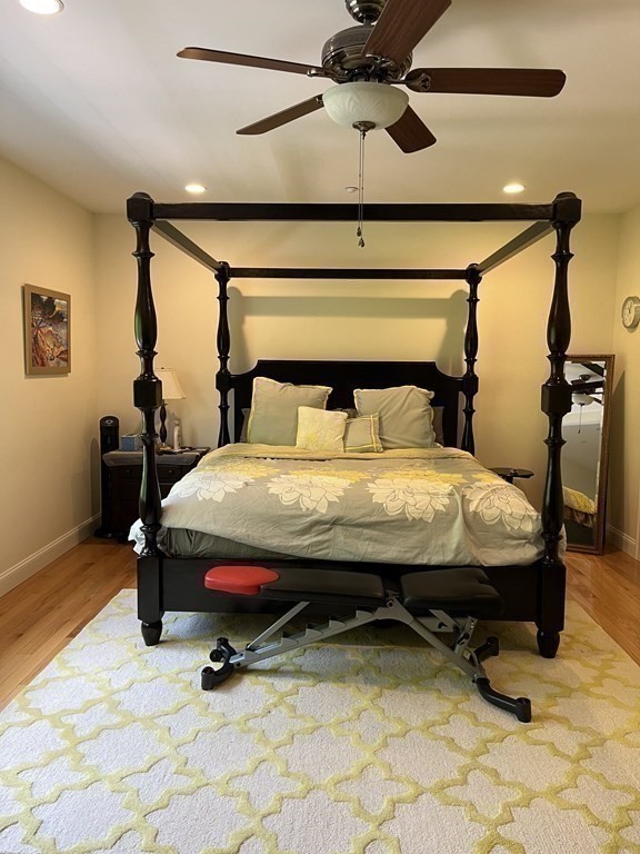 88 Indian Ridge Terrace, Unit 88 Westford, MA 01886 - Photo 21 of 39 a bed sitting in a room next to a lamp