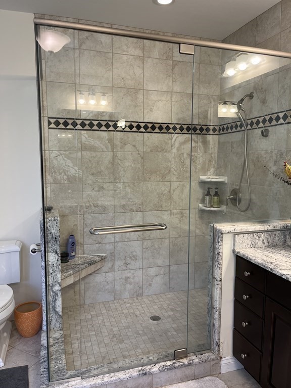 88 Indian Ridge Terrace, Unit 88 Westford, MA 01886 - Photo 25 of 39 a bathroom with a shower