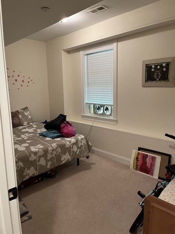 88 Indian Ridge Terrace, Unit 88 Westford, MA 01886 - Photo 33 of 39 a bedroom with a bed and a window