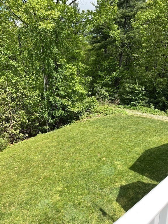 88 Indian Ridge Terrace, Unit 88 Westford, MA 01886 - Photo 38 of 39 a view of outdoor space with a yard
