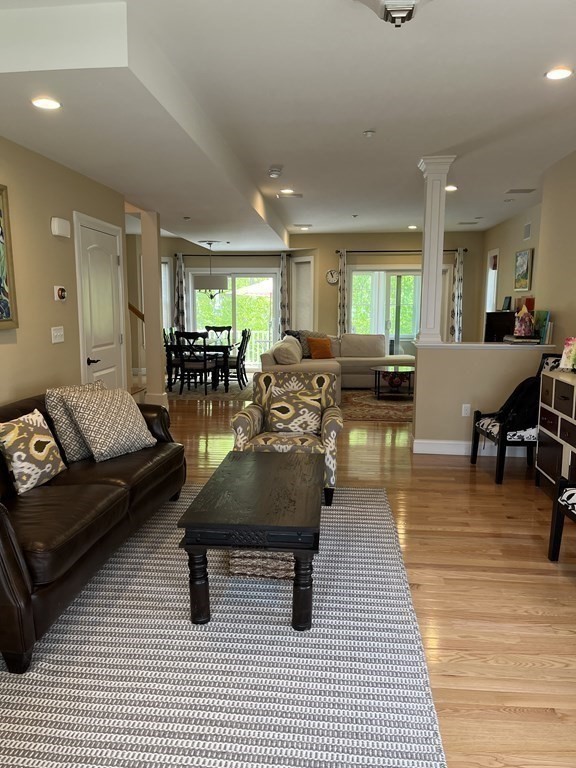 88 Indian Ridge Terrace, Unit 88 Westford, MA 01886 - Photo 4 of 39 a living room with furniture and wooden floor