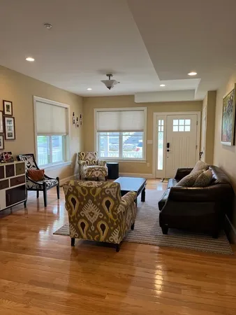 a living room with furniture and a large window