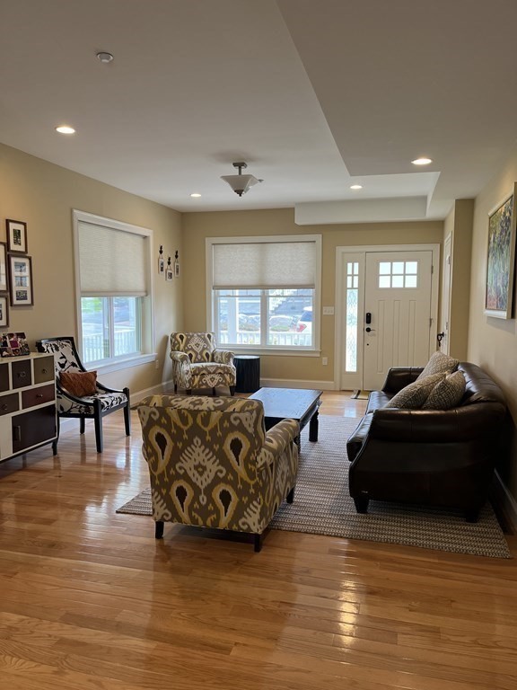 88 Indian Ridge Terrace, Unit 88 Westford, MA 01886 - Photo 6 of 39 a living room with furniture and a large window