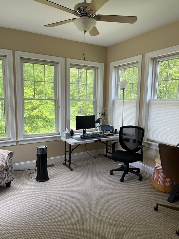 88 Indian Ridge Terrace, Unit 88 Westford, MA 01886 - Photo 9 of 39 a living room with furniture and a window