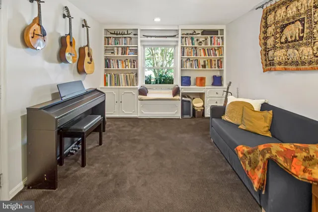 a living room with furniture rug and window