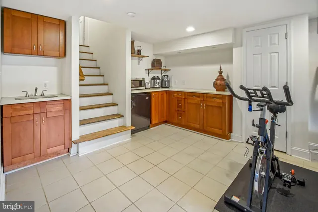 a view of a patio with chair and table back yard of the house
