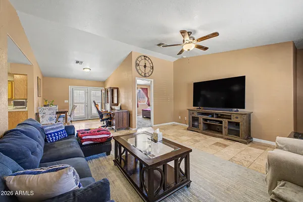 a living room with furniture and a flat screen tv