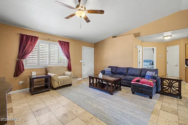 a living room with furniture and a window