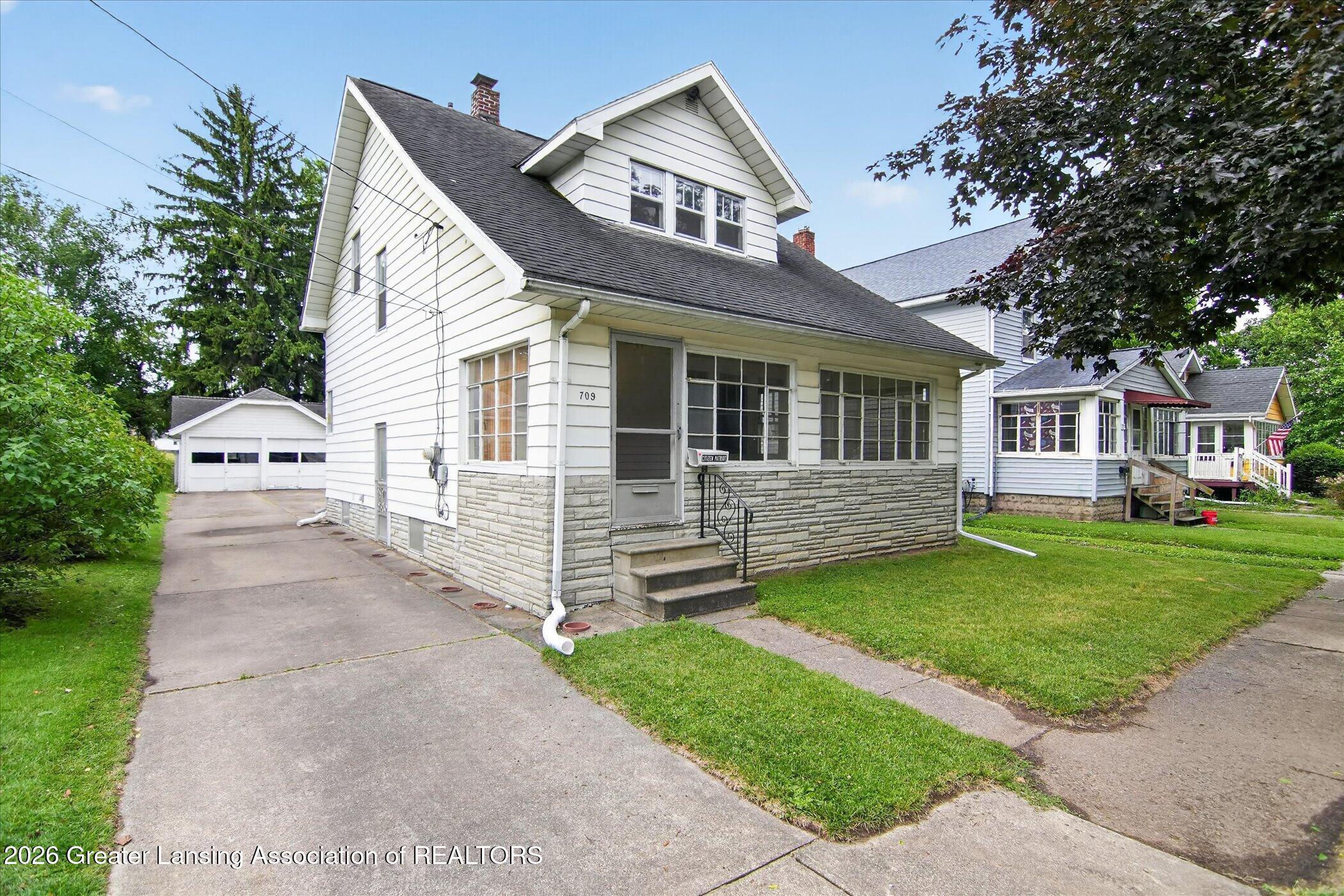 709 Rock Street Jackson, MI 49202 - Photo 2 of 53 02-709-Rock-St-WindowStill