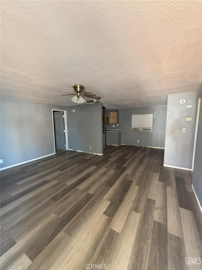 1405 West St George Avenue Ridgecrest, CA 93555 - Photo 6 of 27 a view of a room with wooden floor