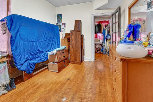 a bed room with a bed and a mirror