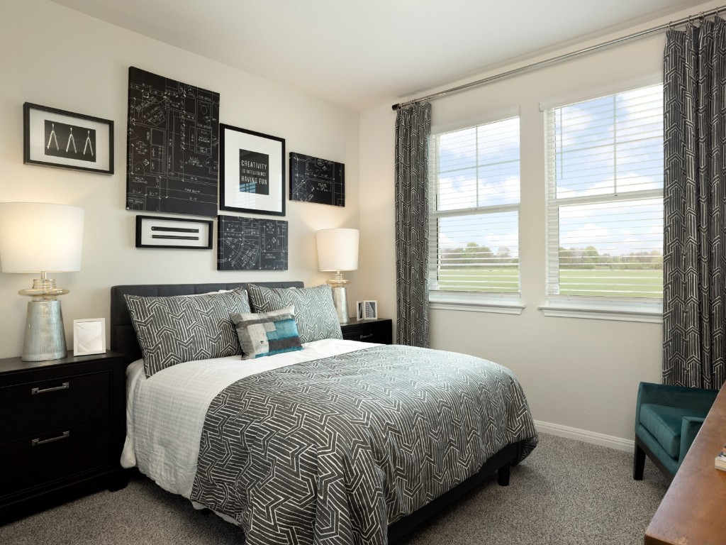 1800 South Main Street Kyle, TX 78640 - Photo 6 of 15 a bedroom with a bed and a window