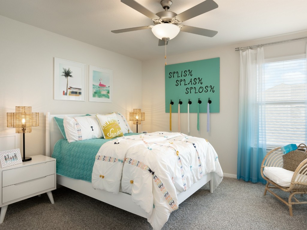 1800 South Main Street Kyle, TX 78640 - Photo 8 of 15 a bedroom with a bed and a chandelier