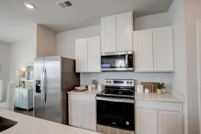 a bedroom with a bed and a couch