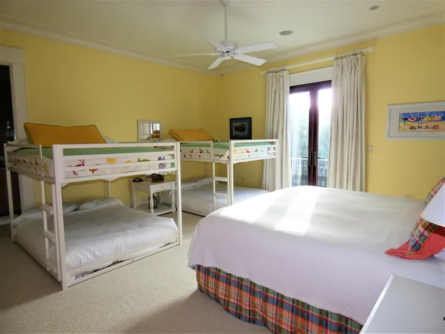 a bedroom with a bed and a table