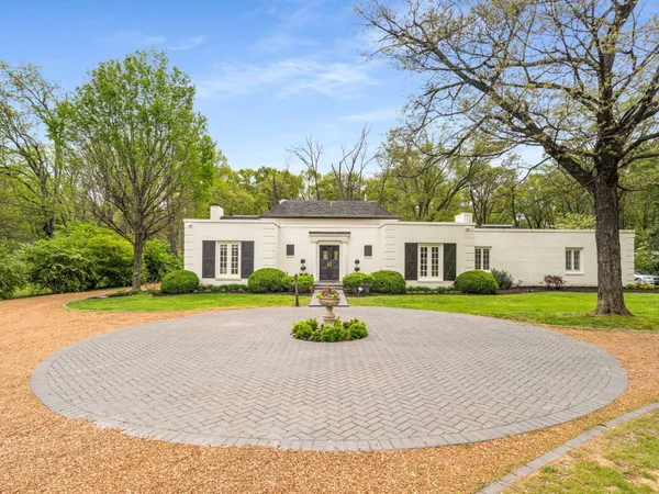 a view of a house with a garden