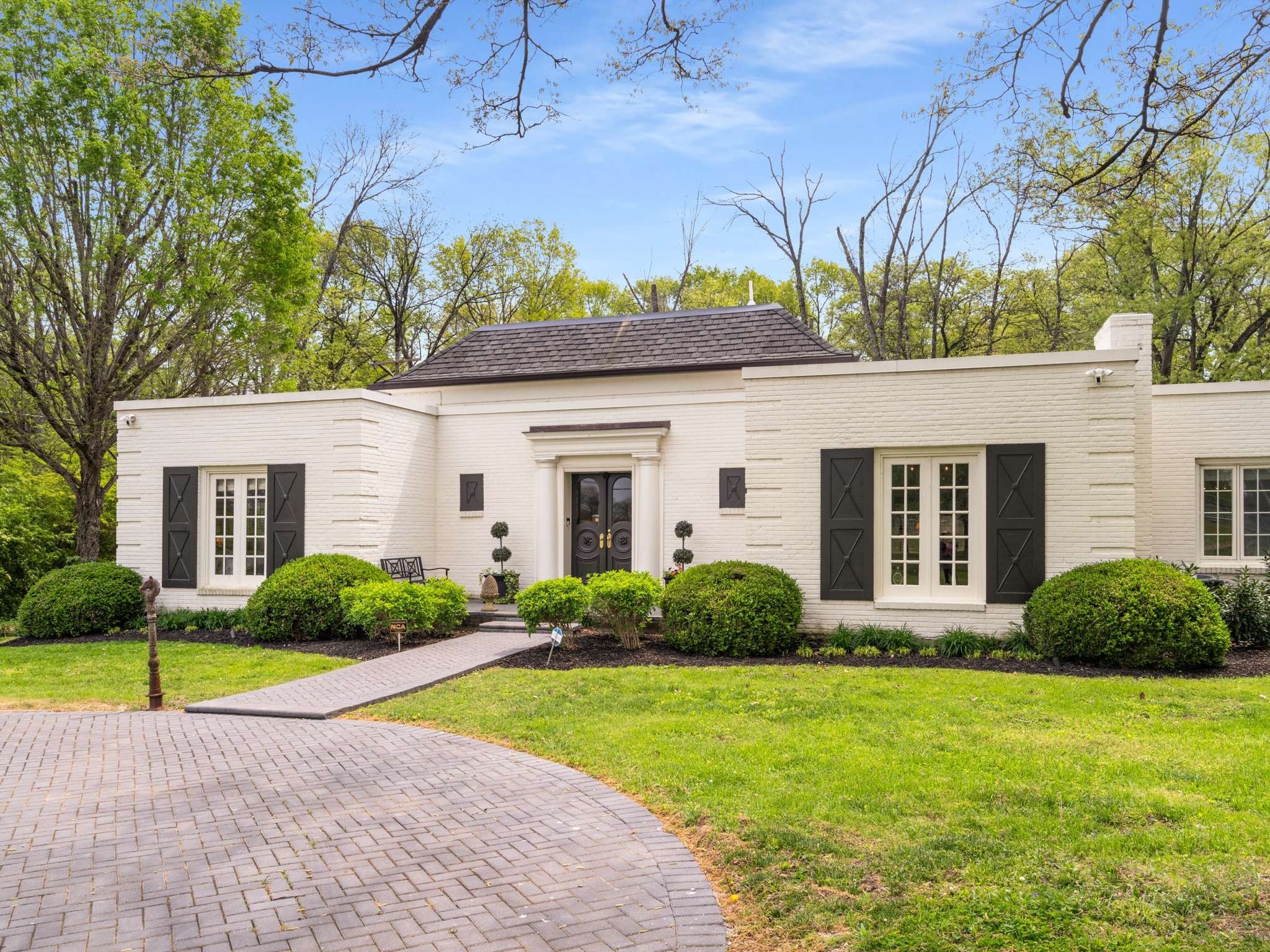 305 Davidson Road Nashville, TN 37205 - Photo 3 of 73 a view of a house with a garden