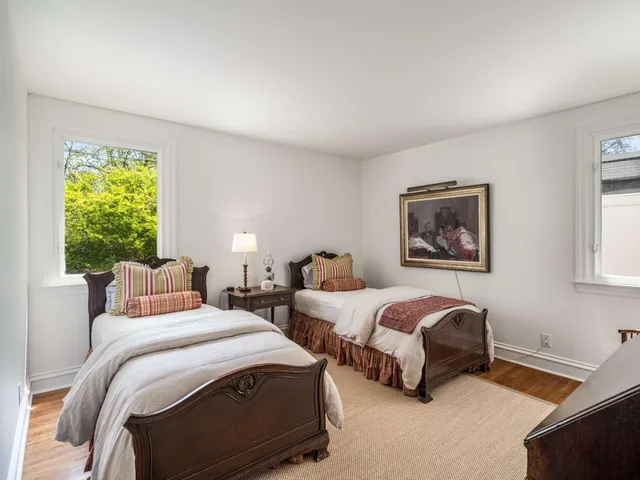 a view of a hallway with paintings on the wall