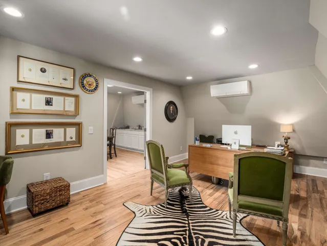 a view of a house with pool and chairs